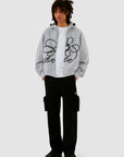 Sweat à capuche zippé avec logo fleuri